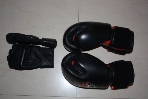 MMA style gloves on the left and 16oz. boxing gloves on the right