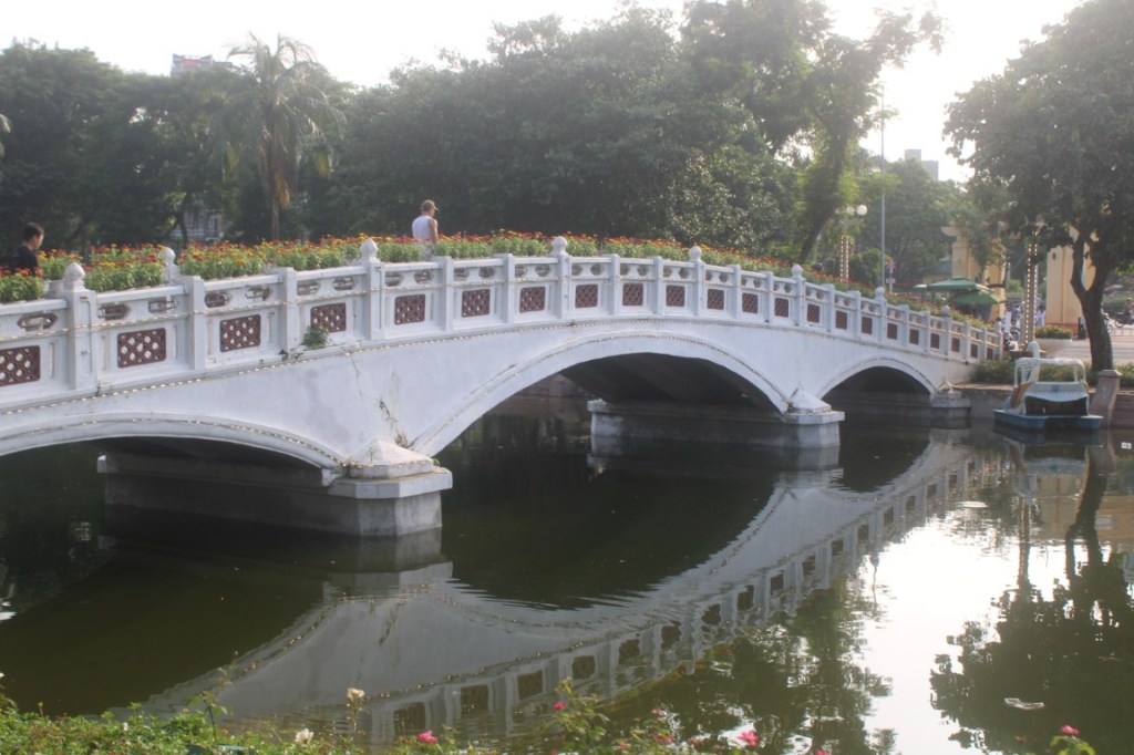 Bridge in Thống Nhất Park to an islet in the lake. Hanoi, Vietnam.