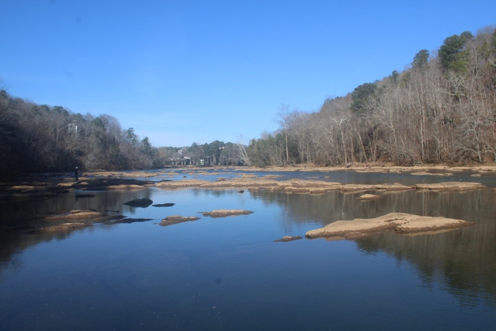 The Chattahoochee River with stony protrusions in Paces Mill Park.