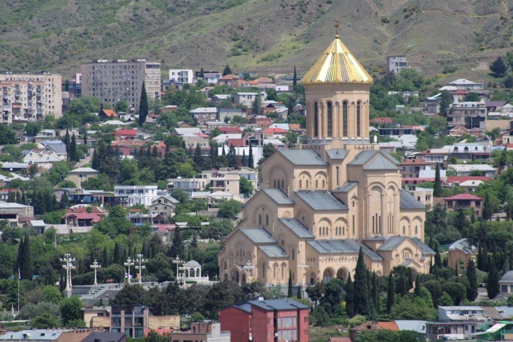 Photograph of Holy Trinity Cathedral in Tbilisi, Georgia taken from the hills across the river. 