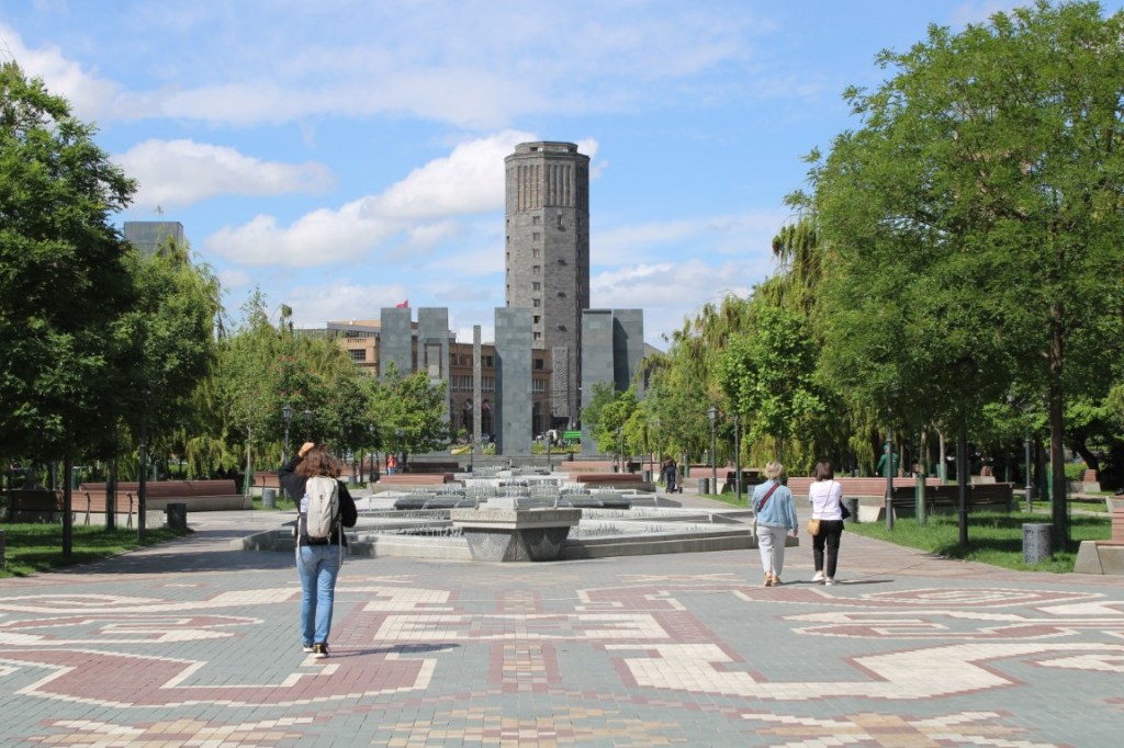 Photograph taken in Vardanians' Park toward the Prosperous Armenia Party building (tower background), across Myasnikyan Square.