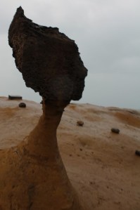 Haiku poem about "Queen's Head," a naturally occurring rock formation that looks like a graceful lady's neck and head (located in Yehliu Geologic Park.)