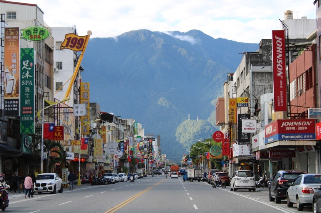 Photograph looking down Zhongshan Road toward the green mountains beyond. Taken in Hualien.