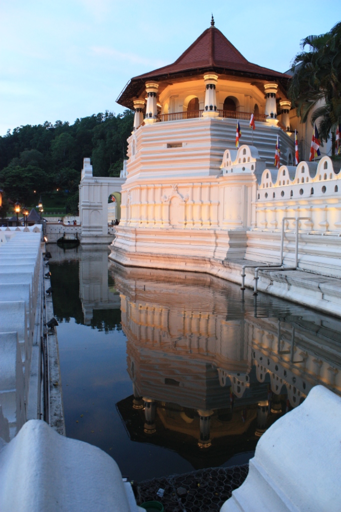 Photograph of a tower reflected in a moat at Kandy's Temple of the Tooth.