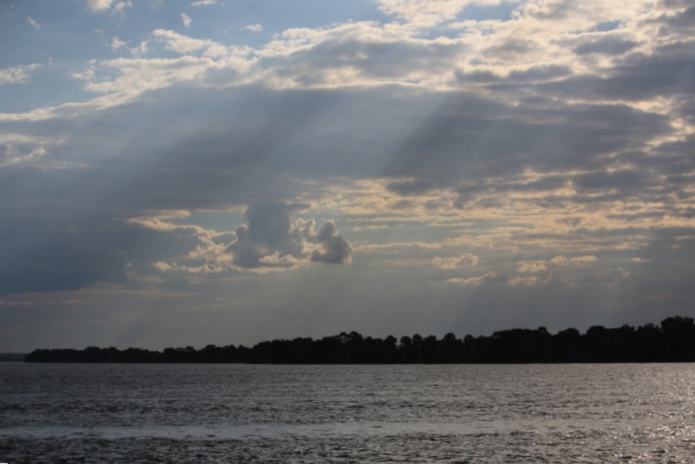 Photograph of the Zambezi River between Zambia and Zimbabwe as the sun is getting low.