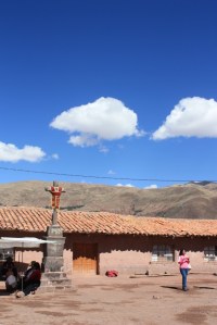 Photograph of blue skies over a small roadside stop in the Andes between Cuzco and Puno.