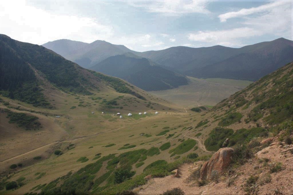 Photograph of valley with yurts in Boz-Salkyn, Kyrgyzstan.