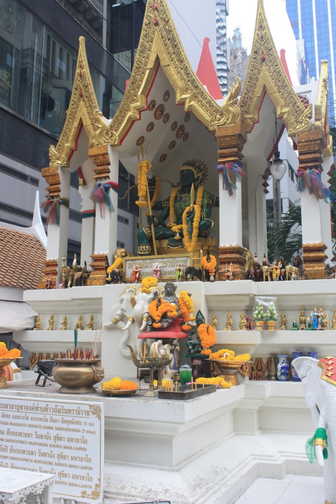 Photograph of a Phra Phrom (Brahma) shrine in the Ratchaprasong area of  Bangkok, Thailand.