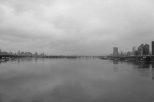Photograph taken from a bridge over the Tamsui River in Taipei, Taiwan on a rainy day.