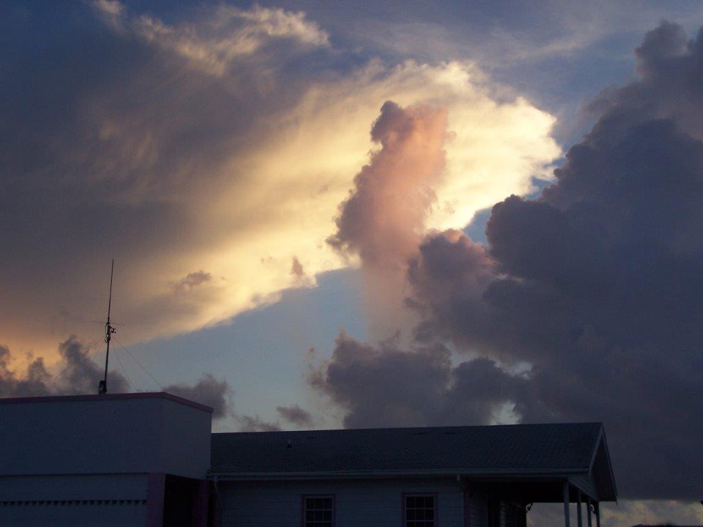 Photograph of clouds, oddly lit, taken in Corozal, Belize. 