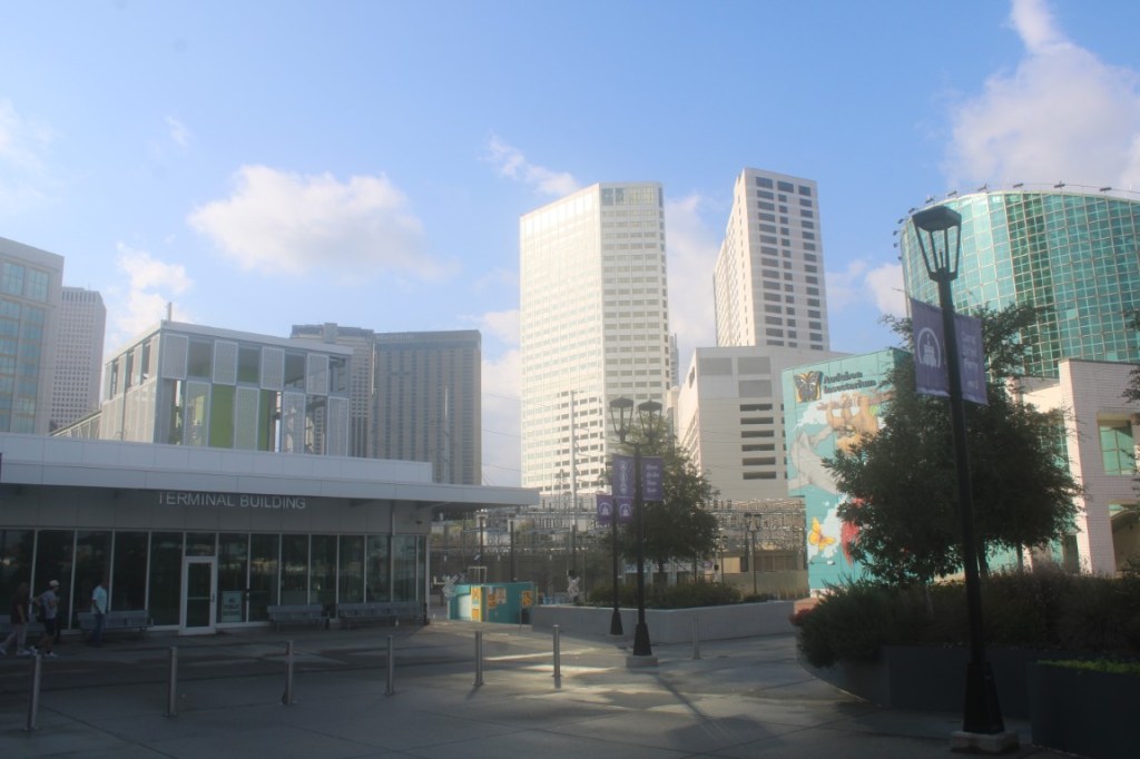 Photograph of buildings in New Orleans from near the end of Canal Street. 