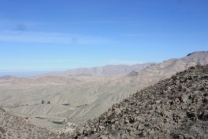 Photograph of mountainous desert with bare soil high in the Andes. 