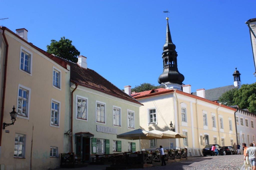 Photograph taken in the Old Town of Tallinn, Estonia, featuring the steeple of St. Mary's Cathedral.