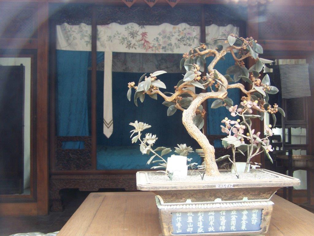 Photograph of a bonsai tree in a bedroom in the Forbidden City of Beijing.