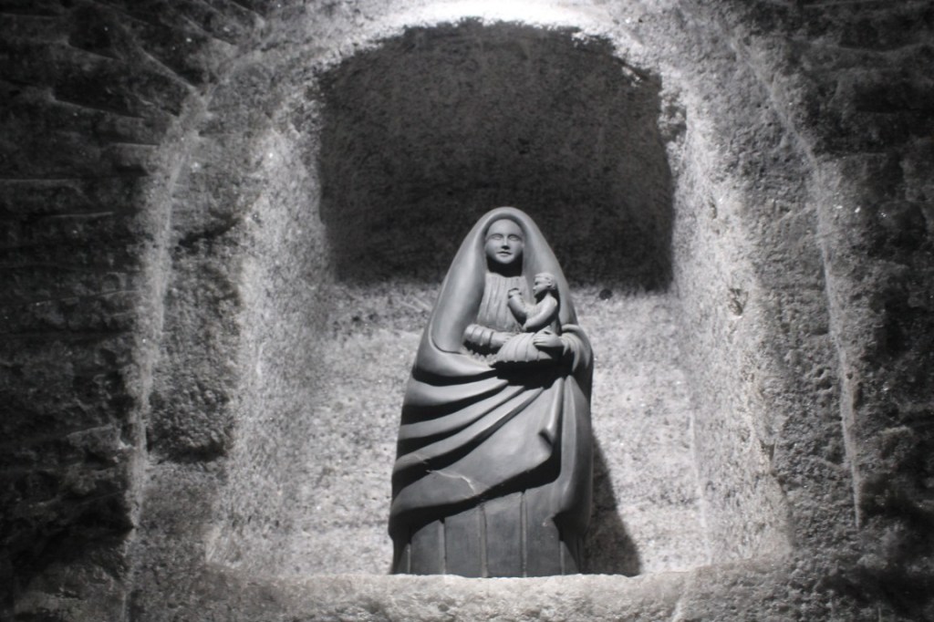 Photograph of a stone carved Virgin with baby Jesus in the Zipaquira Salt Cathedral in Colombia. 