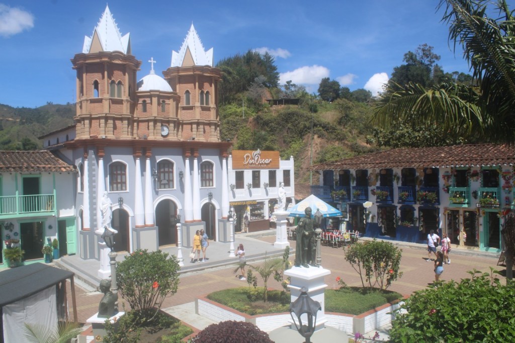 Photograph of the town square at the Replica of Old Peñol (Réplica del Vieja Peñol) near Guatape, Colombia. The original Old Peñol was flooded when they dammed to make a reservoir lake.
