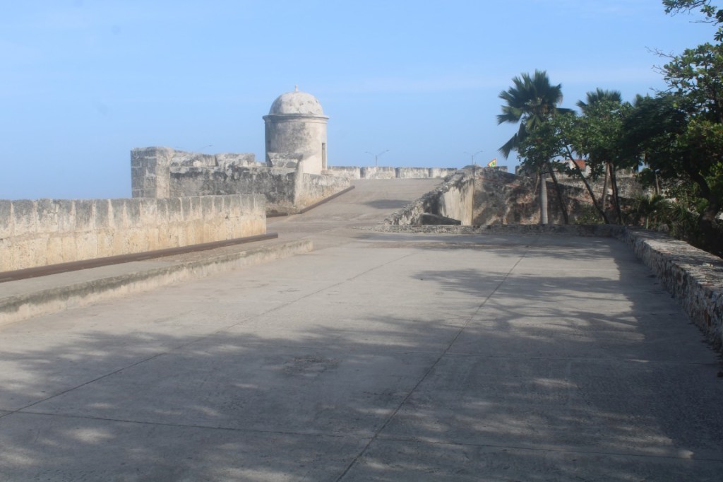 Photograph atop Cartagena's City Wall showing an outpost and blue sky.