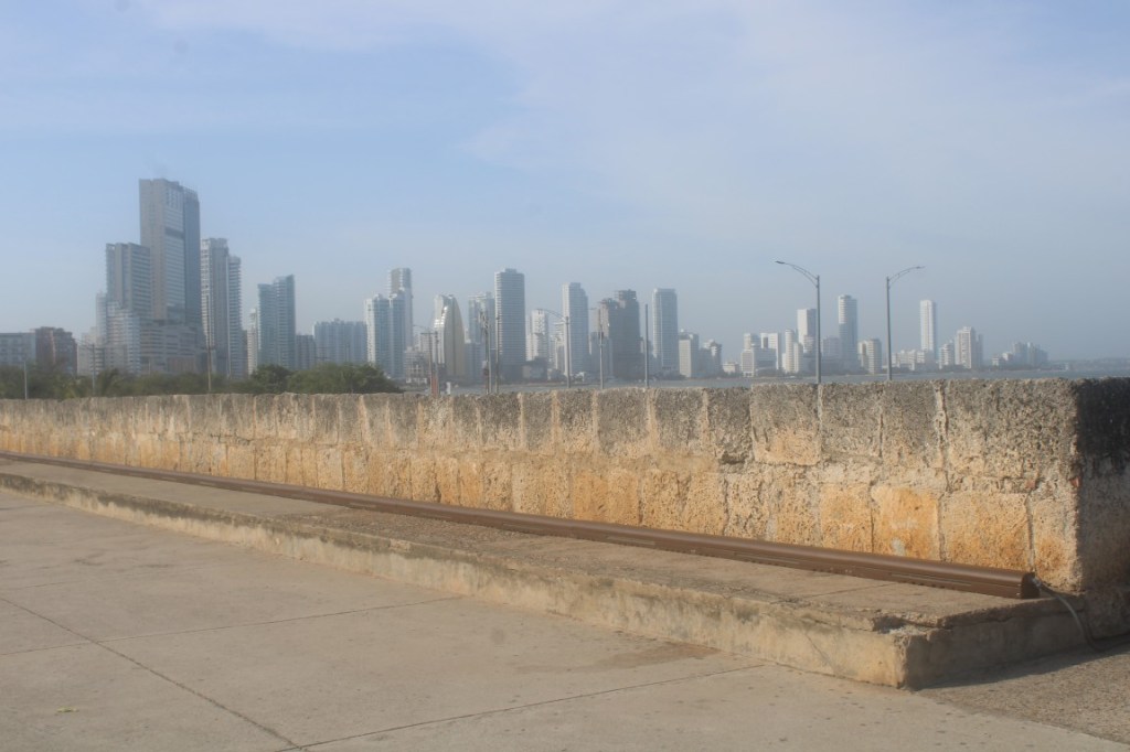 Photograph taken atop the city wall, showing the skyline of el Laguito in the distance.