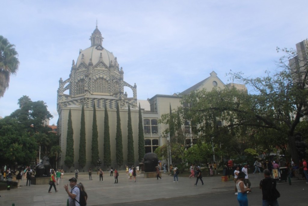 Photograph taken across Botero Plaza of the Palace of Culture Rafaél Uribe in Medellin, Colombia.