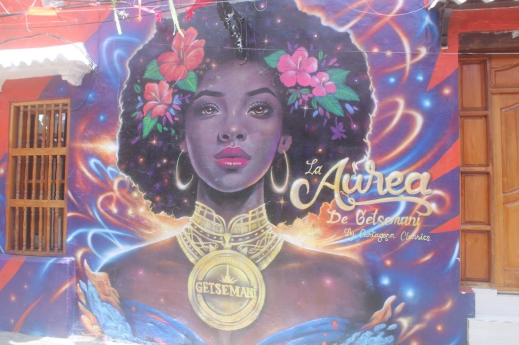 Photograph of a woman's face painted on walls in Barrio Getsemaní of Cartagena, Colombia.